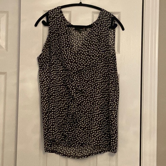 Sleeveless blouse with flared neckline - Picture 1 of 5